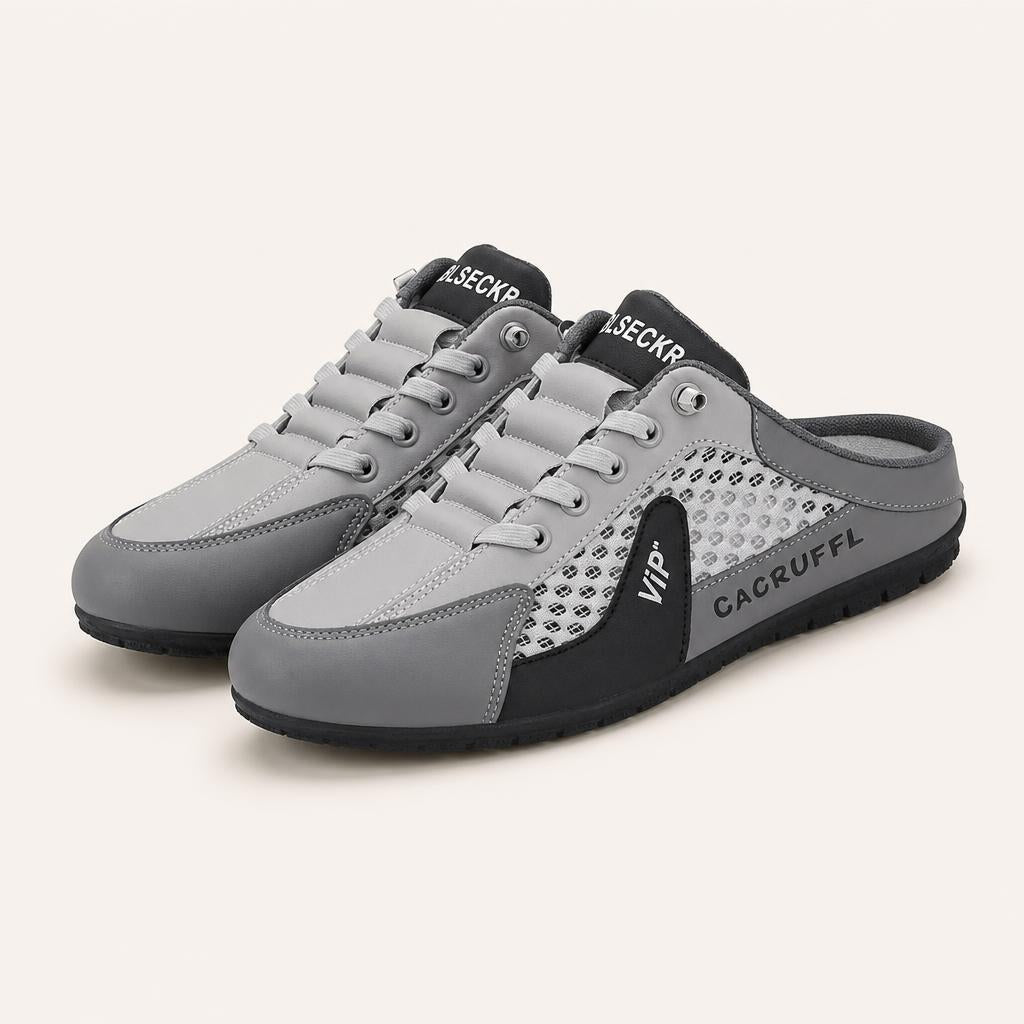 Zapatillas mule de hombre en gris, vista de tres cuartos